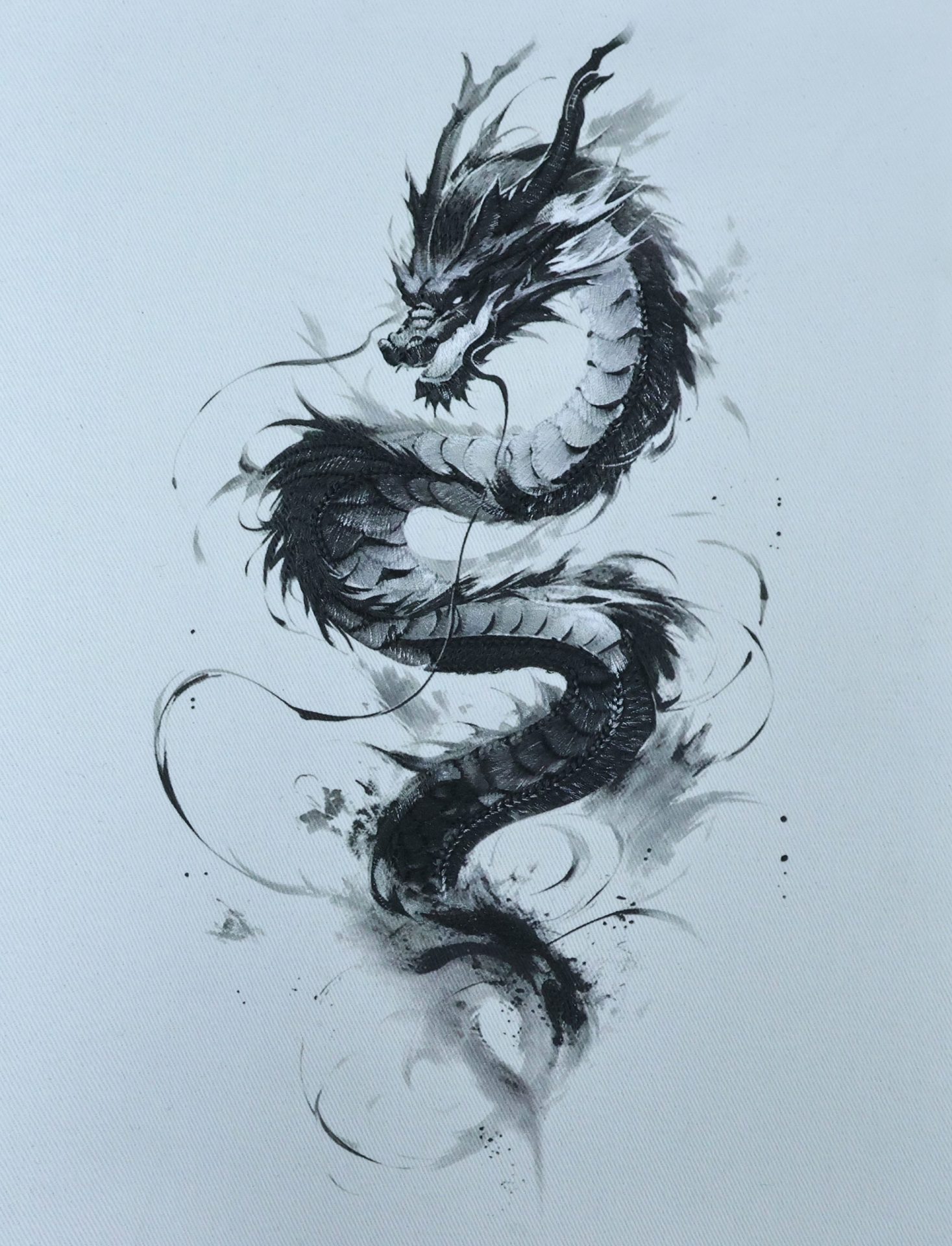 Monochrome dragon sample, Black tonal artwork on a light garment panel