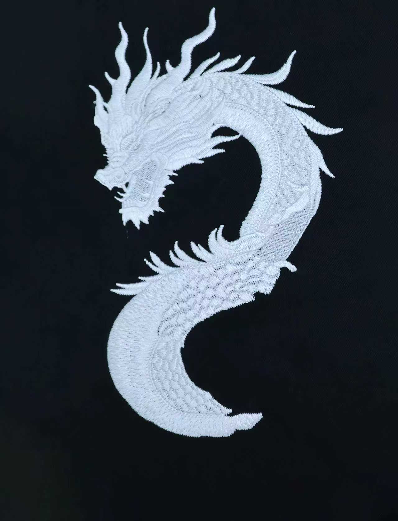 White dragon sample, White-detail DTG print on a dark garment panel